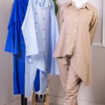 طقم نسائي بأطراف غير متساوية مع أزرار ذهبية